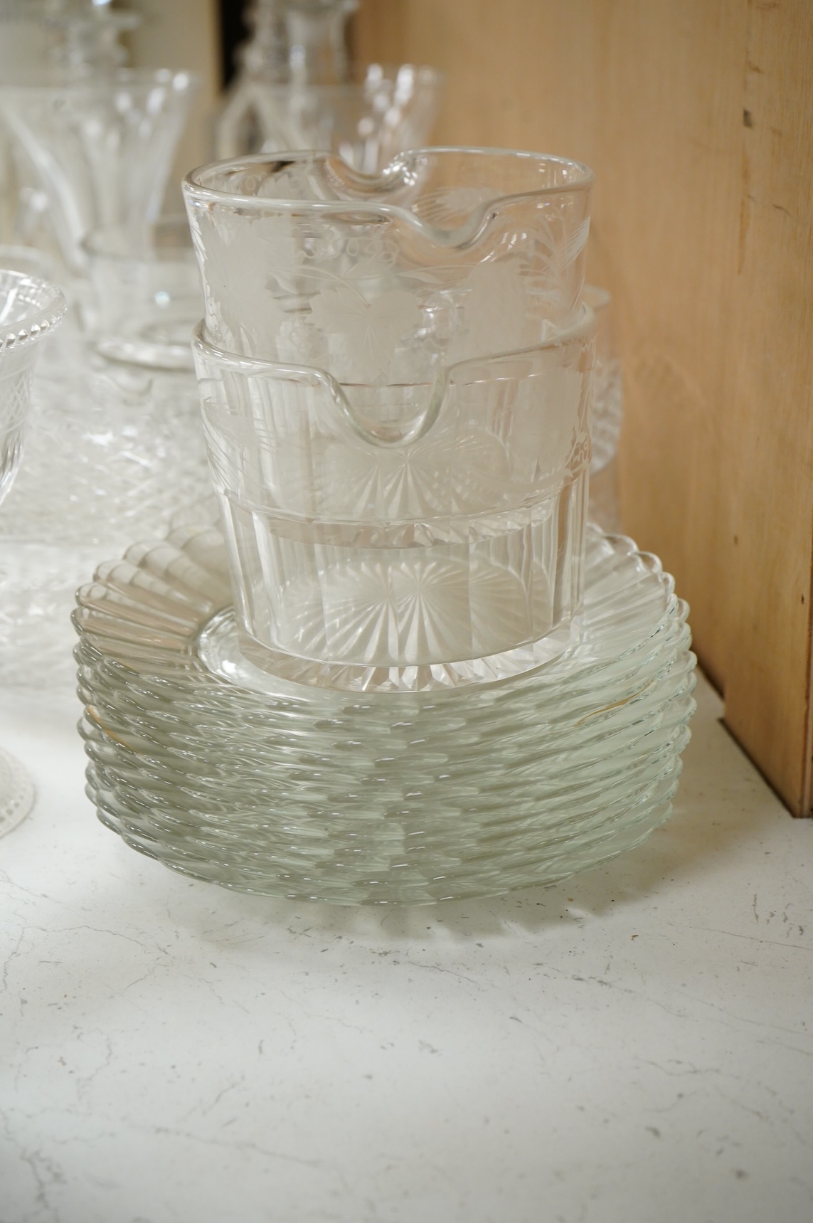 A collection of 19th century and later glassware, to include: Three fluted wine glasses two rummers, various risers and finger bows, decanters etc